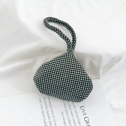 Flat lay of Mini Diamond Party Handbag in black, great for everyday carry and travel.