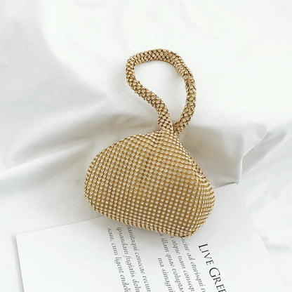 Close-up of Gold rhinestone mini diamond party handbag with a braided handle.