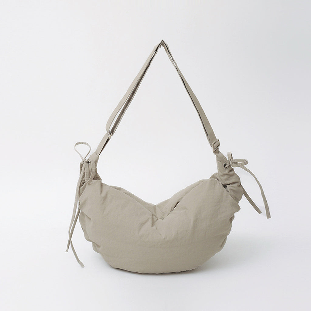 Front view of the khaki mini duvet crescent bag showing the adjustable drawstring and ruched texture.