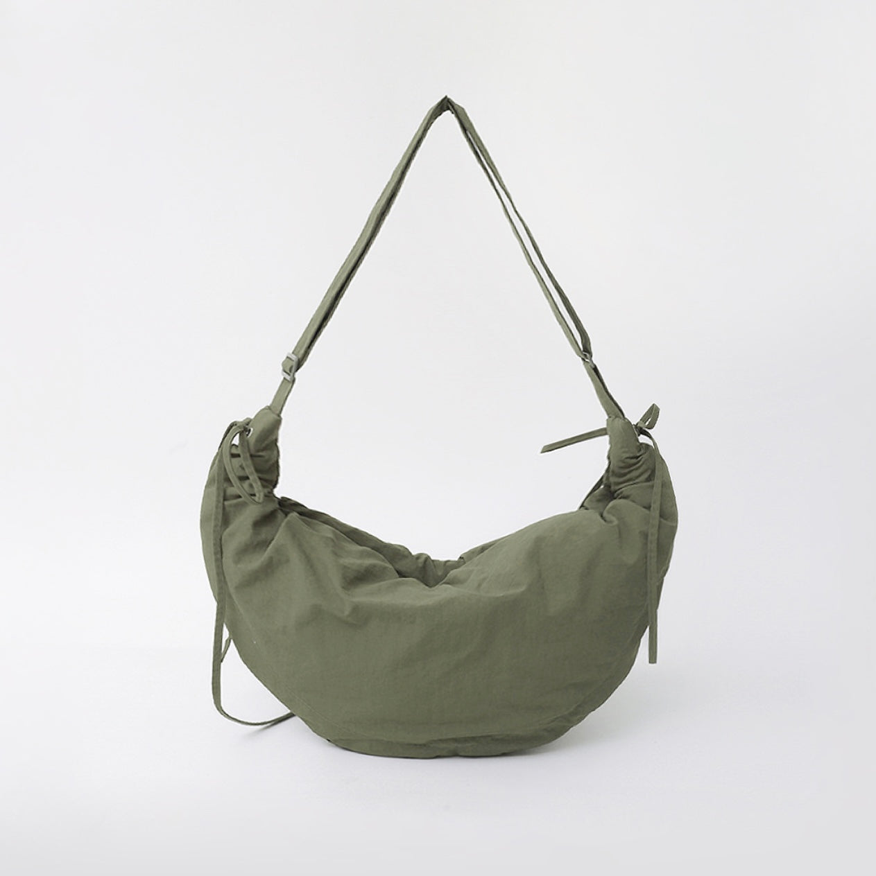Olive green version of the duvet crescent bag featuring the ruched texture.