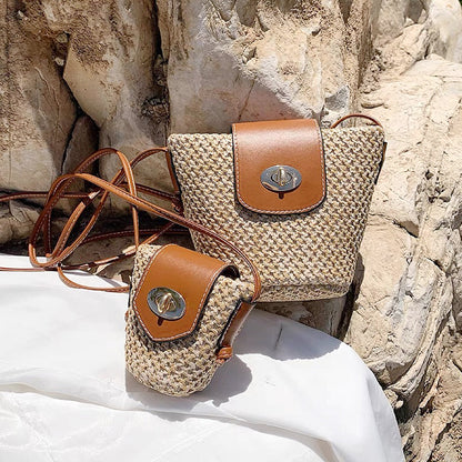 Front view of Two mini PU mix raffia straw bucket crossbody bags, one large and one small.