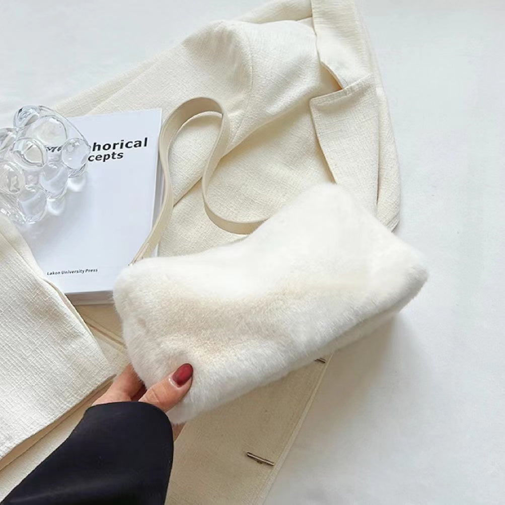 Close-up of Mini Shearling Baguette Bag in white, easy for commuting and weekends.