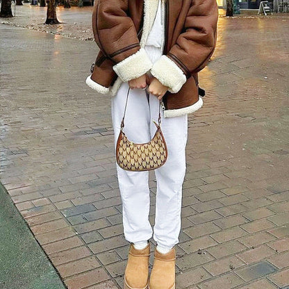 Model holding a brown Monogram Crescent Bag, ideal for errands and gifting.