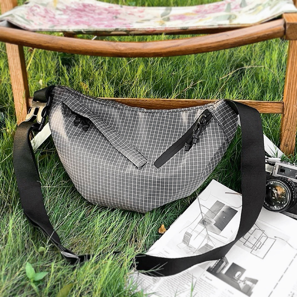 Front view of grey Plaid Venture Nylon Sling Bag, ideal for errands and gifting.