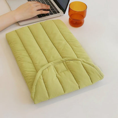 Olive yellow quilted puffy cotton laptop sleeve with a minimalist design.