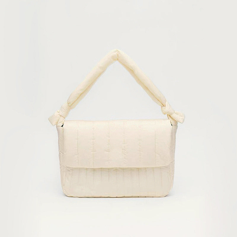 Front view of Puffy Knot Quilted Bag in cream white, great for everyday carry and travel.