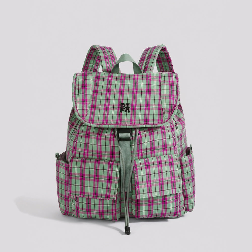 Studio flat lay of the pink and green retro colorblock plaid nylon backpack with front pocket details.