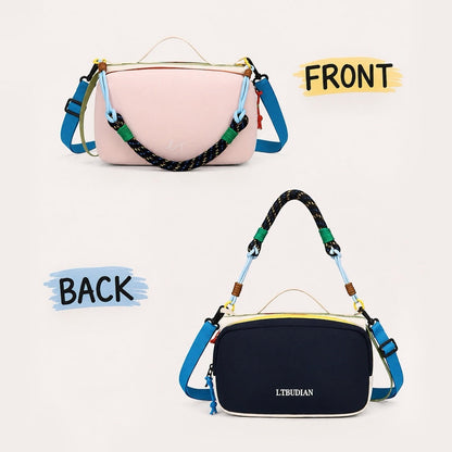 Front pink side and reversed navy blue back side display of the reversible nylon crossbody pouch.