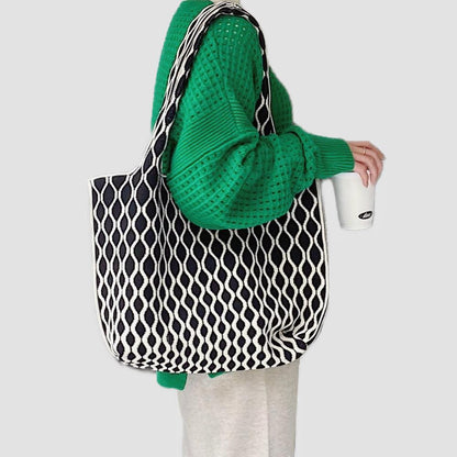 Model carrying a black Ripple Texture Tote Bag on shoulder, ideal for city walks and gifting.