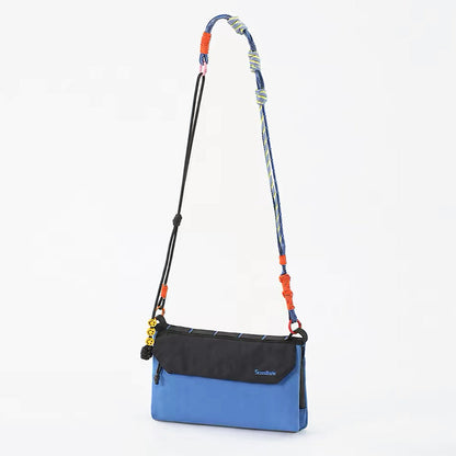 Front view of the blue Rope Play convertible bag.