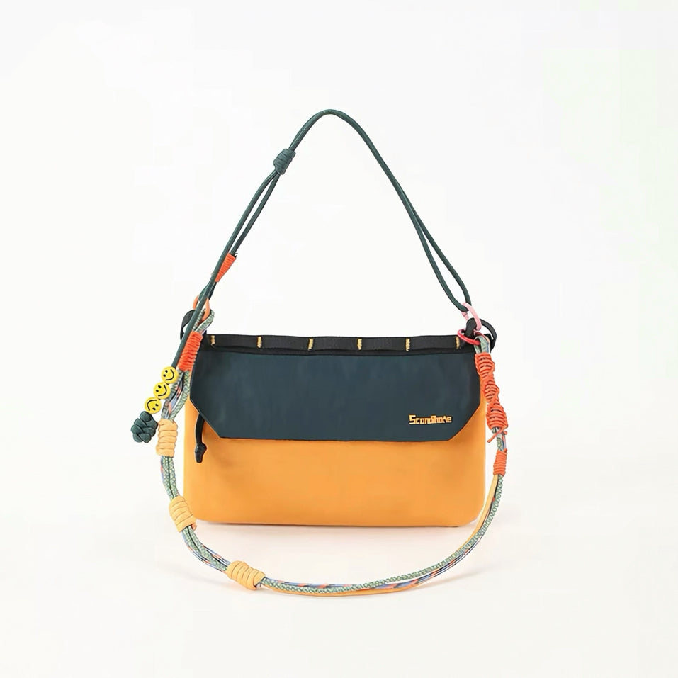 Front view of Yellow and green Rope Play bag styled as a shoulder purse.