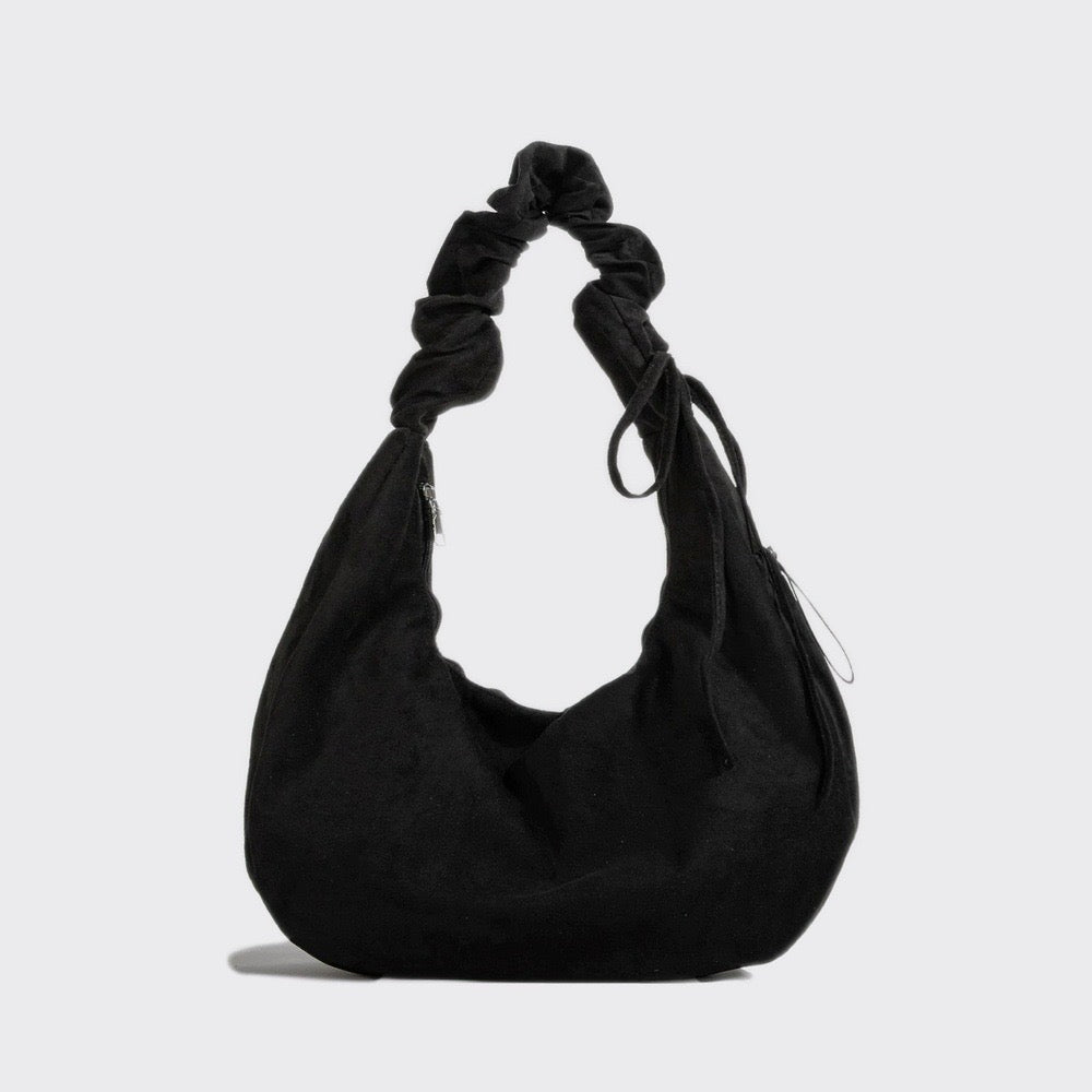 Flat lay of Ruched Strap Suede Hobo Bag in black, great for everyday carry and travel.