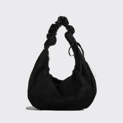 Flat lay of Ruched Strap Suede Hobo Bag in black, great for everyday carry and travel.