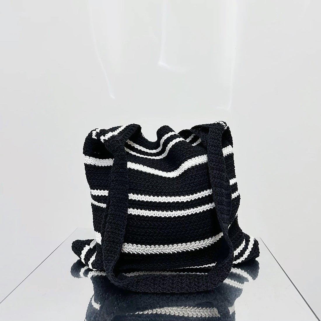 Folded view of black and white Simple Striped Knitted Bag, ideal for errands and gifting.