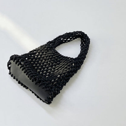 Close-up of Small Multi-Colored Crochet Handbag in black, easy for commuting and weekends.