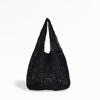 Angled view of Square Pattern Crochet Bag in black, great for everyday carry and travel.