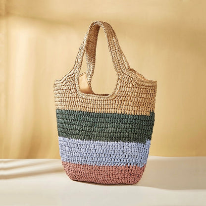 Stripe rattan straw tote bag with natural, green, light blue, and pink horizontal stripes.
