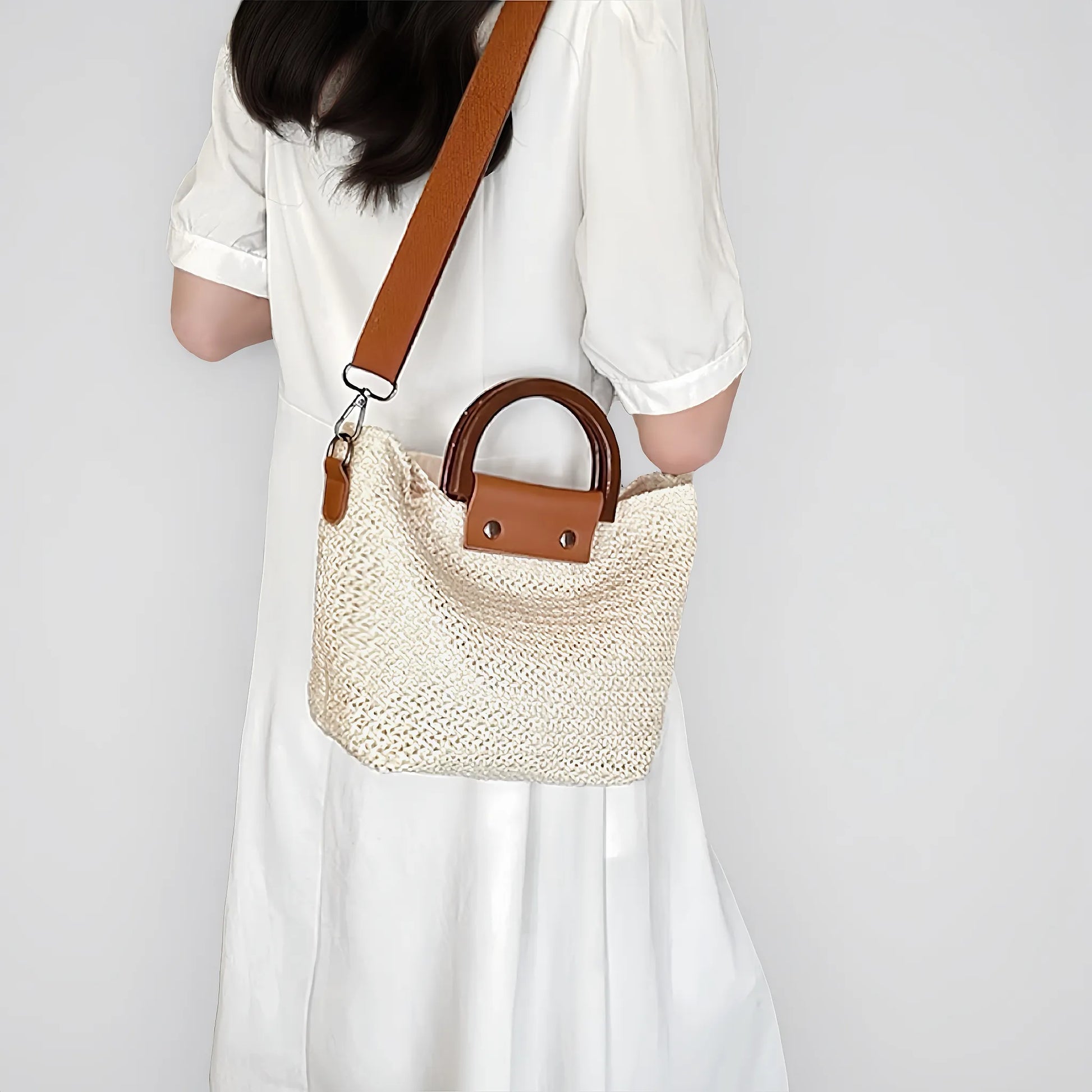 Model carrying a white polyester bag on her shoulder, easy for commuting and weekends.