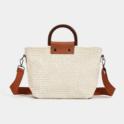 Flat lay of Sunny Straw Woven Bag in white, great for everyday carry and travel.