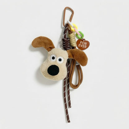 Close-up of the Super Dog bag charm with carabiner, ropes and heart tag.