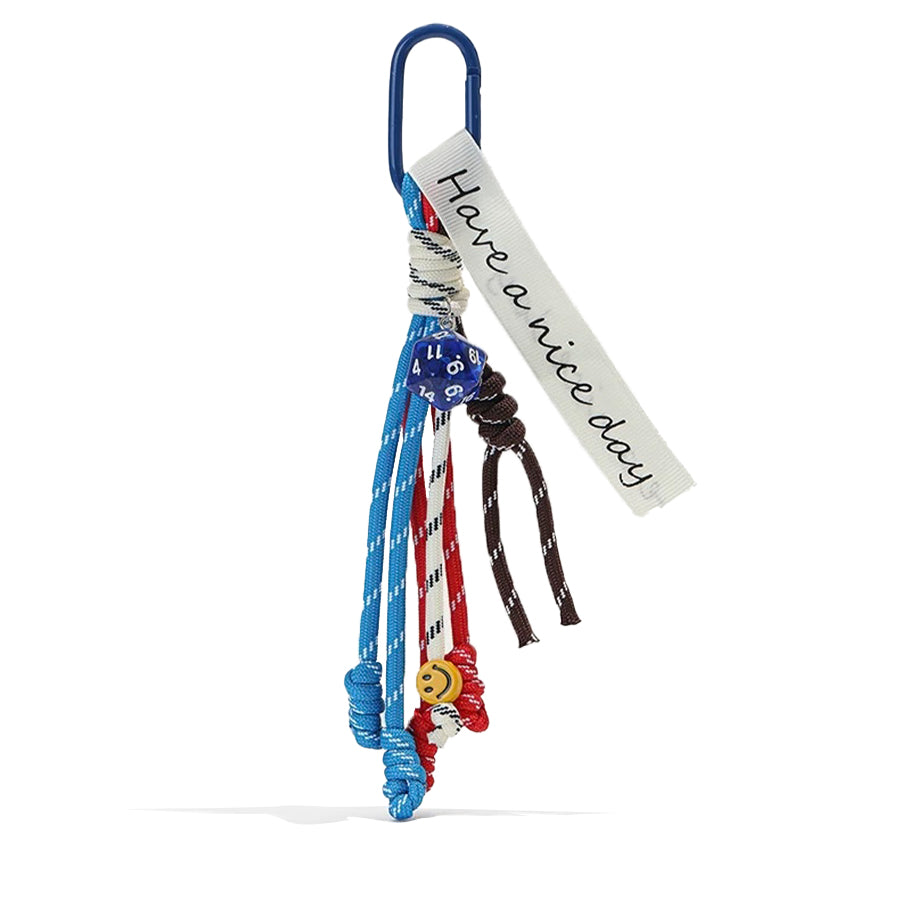 Close-up of Tassel Strings Bag Charm in blue, ideal for travel and daily use.