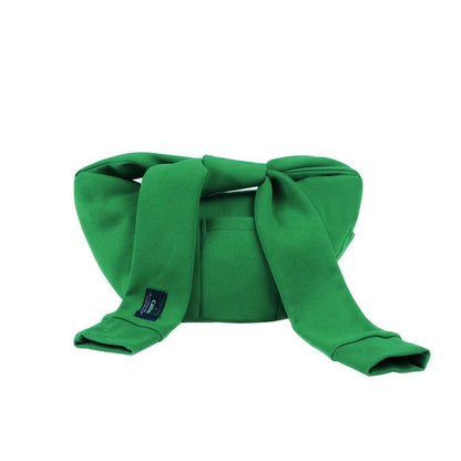 Flat lay of Twist & Tie Sleeve Bag in green, ideal for errands and gifting.