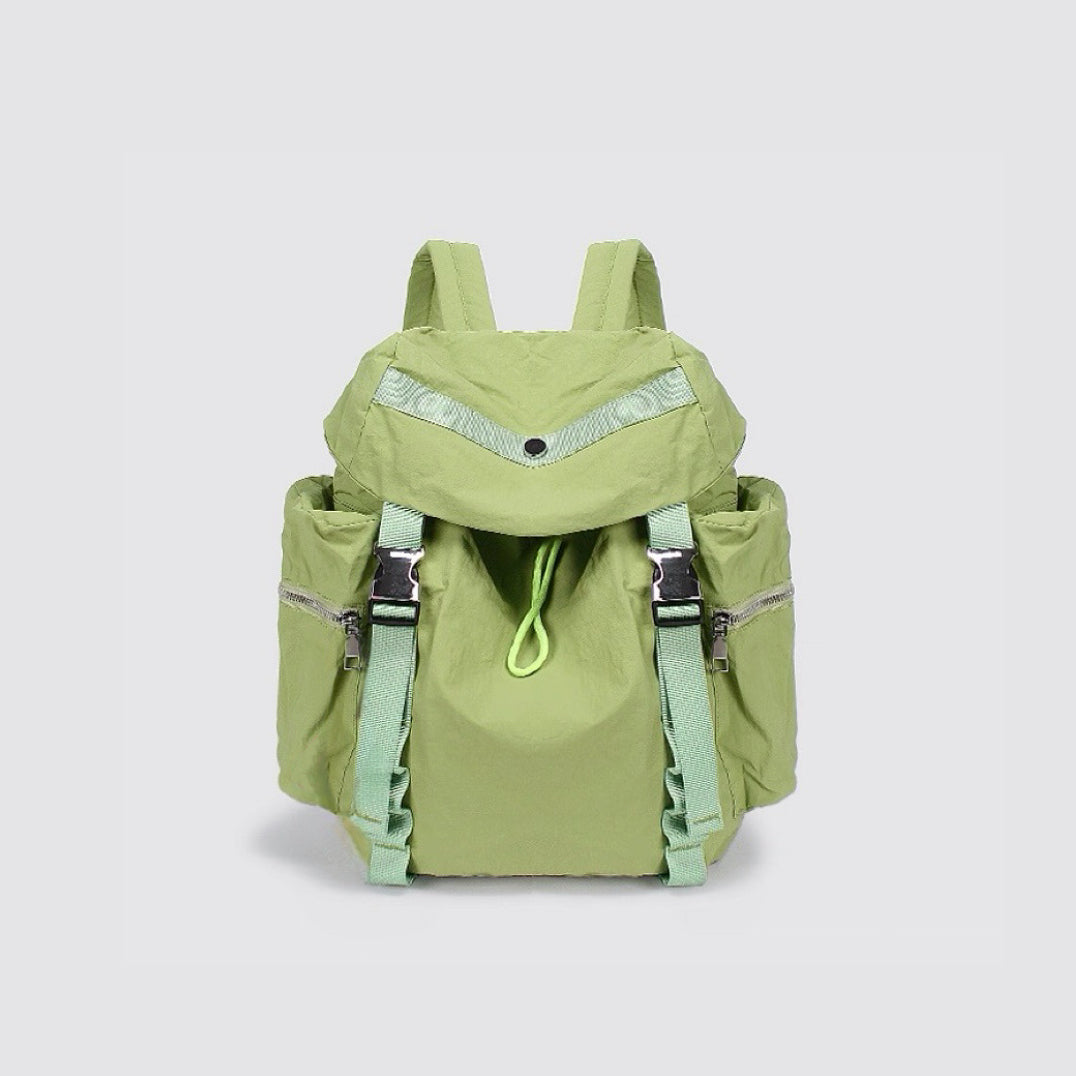 Close-up of Ultralight Urban Daily Backpack in green, vibrant outdoor gear.