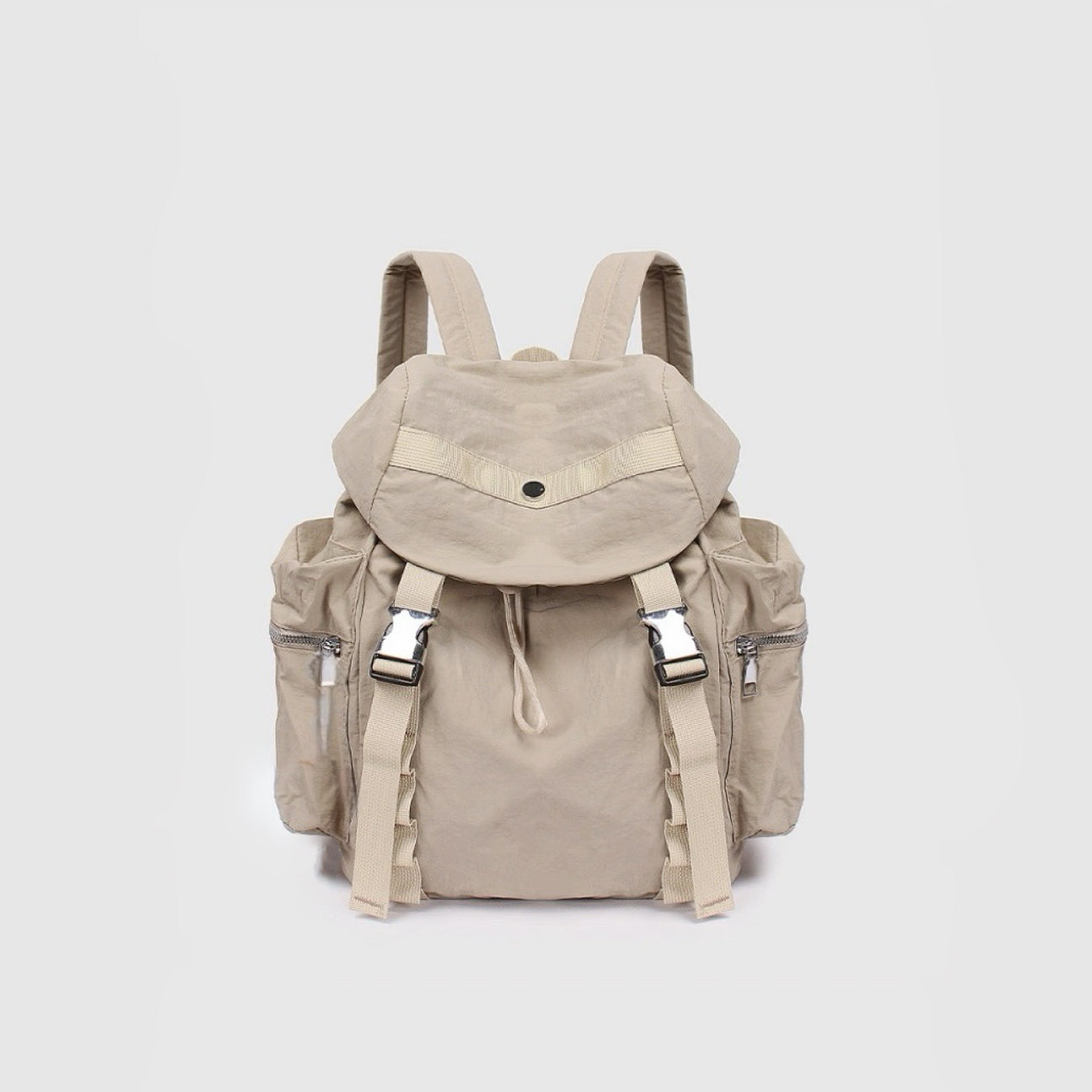 Angled view of khaki polyester ultralight urban daily backpack with flap top, dual buckles, drawstring, and side zip.