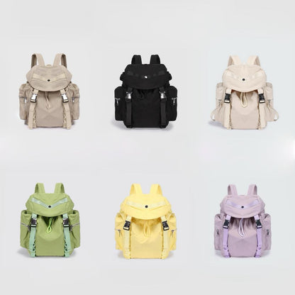 Front view of Six polyester Ultralight Urban Daily Backpacks in beige, black, cream, green, yellow, and lavender.