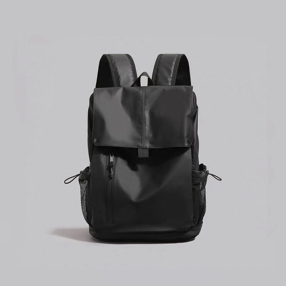 Front view of the black water-resistant Oxford flap backpack with front zip pocket.