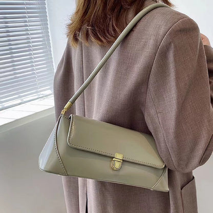Model carring a green Vintage Baguette Shoulder Bag, easy for commuting and weekends.