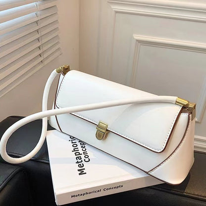 Flat lay of Vintage Baguette Shoulder Bag in white, great for everyday carry and travel.