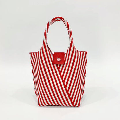 Close-up of Vintage striped knitted polyester handbag with red and white chevron pattern, red strap, and magnetic.