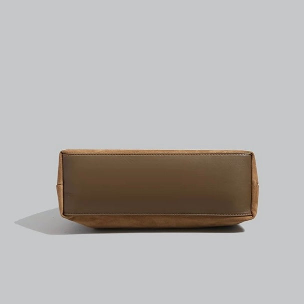 Reinforced base and seamless bottom construction of the vintage suede hobo bag.