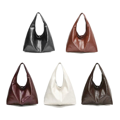 Five waxed leather hobo bag in black, brown, white, ancora red and caramel on a white background.