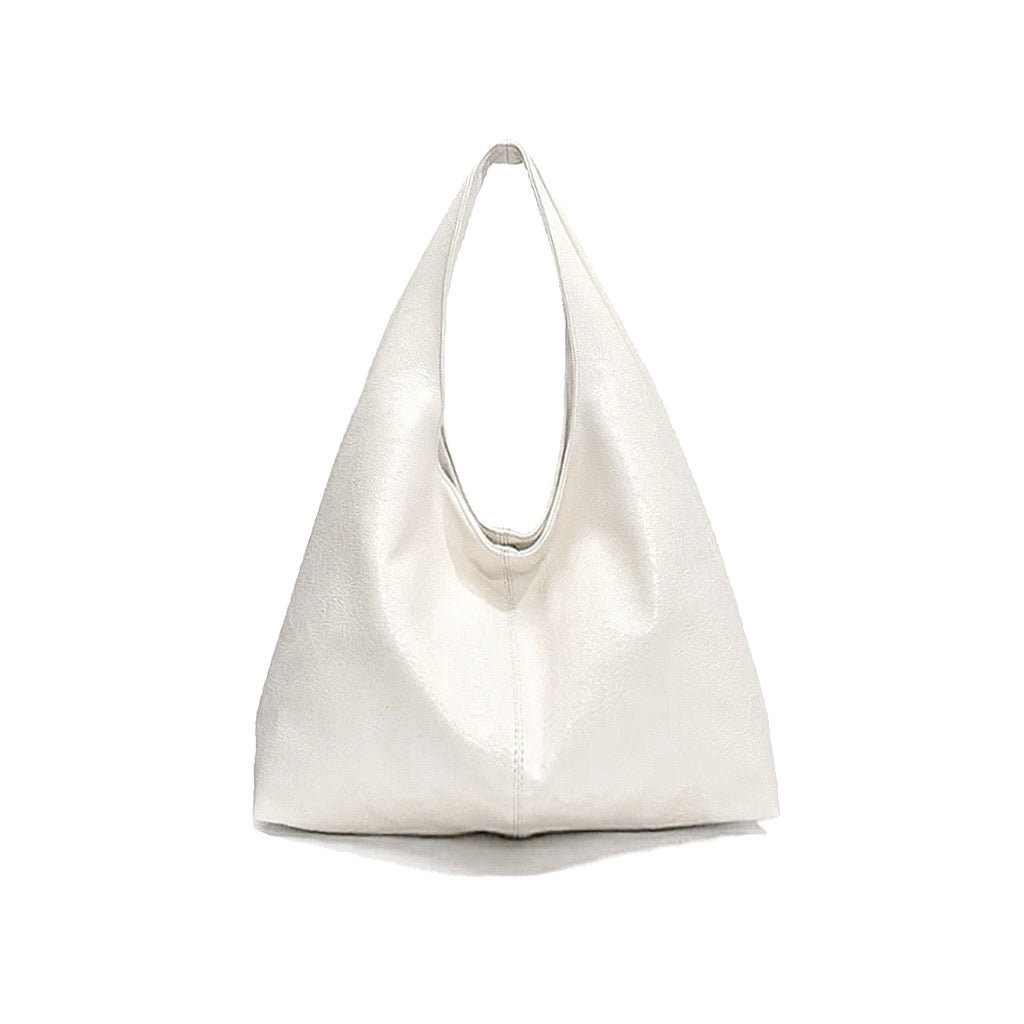 Classic white waxed leather hobo bag showing its soft and slouchy shape.