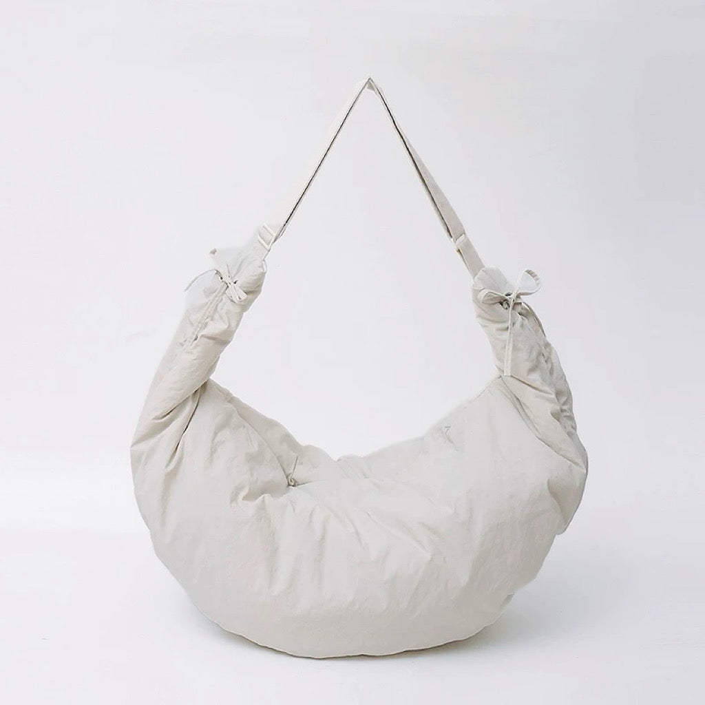 Studio shot of the off-white oversized duvet bag, featuring a soft and lightweight build.