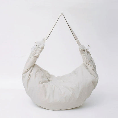 Studio shot of the off-white oversized duvet bag, featuring a soft and lightweight build.
