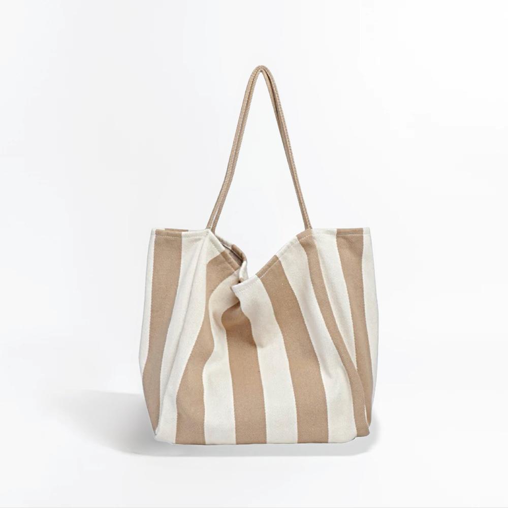 Folded view of Wide Stripe Canvas Tote in khaki,  great for everyday carry and travel.
