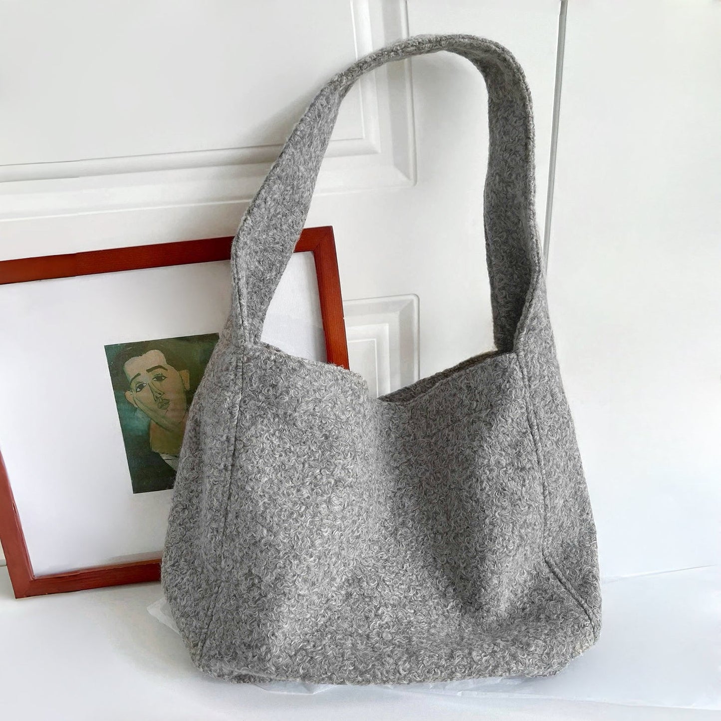 Folded view of Woolish Cozy Tote Bag in gray, easy for commuting and weekends.