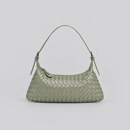 Front angle of a sage green woven leather hobo bag on a white background.