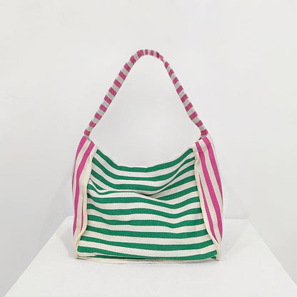 Front view of Zesty Stripe Canvas Tote Bag with green and white horizontal stripes, pink and white striped handles.